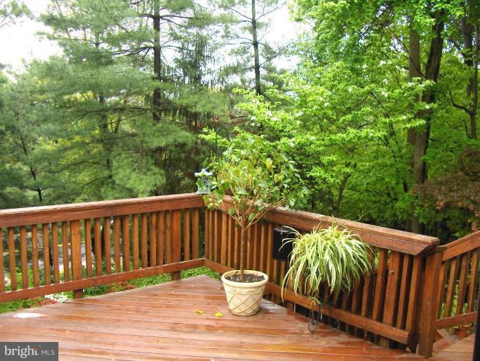 6811 Mallow Court Springfield, VA 22152 - Photo 12 of 30 a balcony with wooden floor and outdoor space