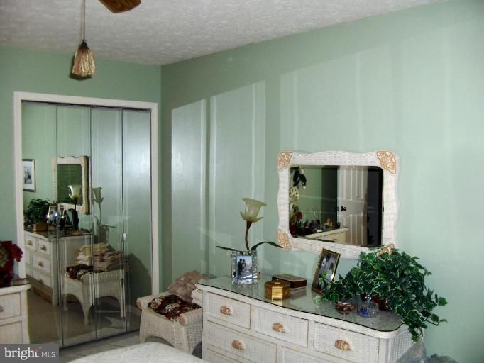 6811 Mallow Court Springfield, VA 22152 - Photo 18 of 30 a bathroom with a sink and mirror