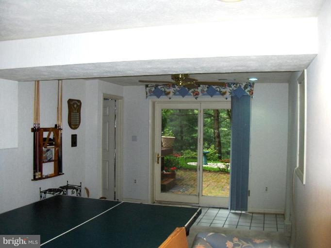 6811 Mallow Court Springfield, VA 22152 - Photo 20 of 30 a view of a room with wooden floor and windows