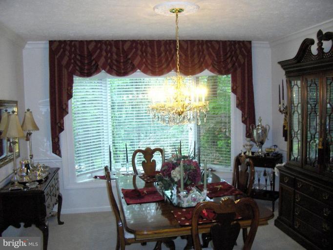 6811 Mallow Court Springfield, VA 22152 - Photo 3 of 30 a view of a dining room with furniture window and outside view