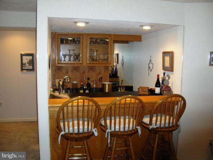 6811 Mallow Court Springfield, VA 22152 - Photo 21 of 30 a dining room with furniture and wooden floor