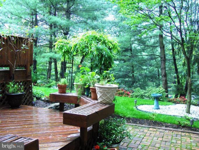 6811 Mallow Court Springfield, VA 22152 - Photo 27 of 30 a view of table and chairs in a garden