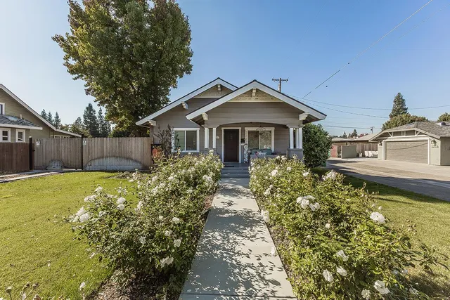 a front view of a house with garden