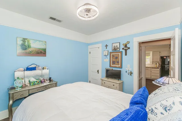 a bedroom with a bed and a table in it