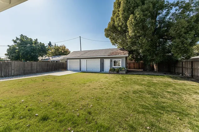 a house with swimming pool in front of it