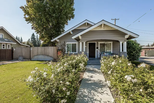 front view of a house with a yard