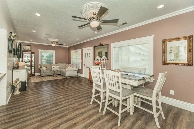 a view of a dining room with furniture window and wooden floor
