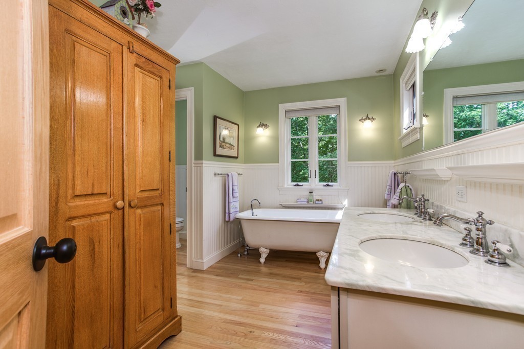 79 East Princeton Road Princeton, MA 01541 - Photo 17 of 30 a bathroom with a granite countertop sink and a mirror
