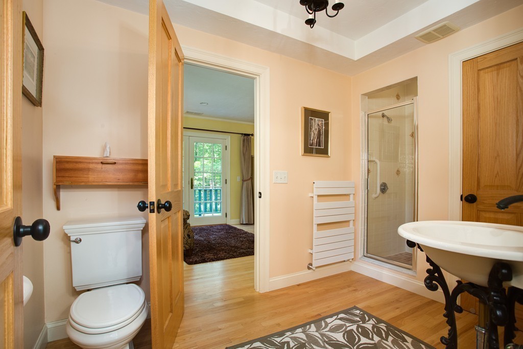 79 East Princeton Road Princeton, MA 01541 - Photo 21 of 30 a bathroom with a toilet a sink and a mirror