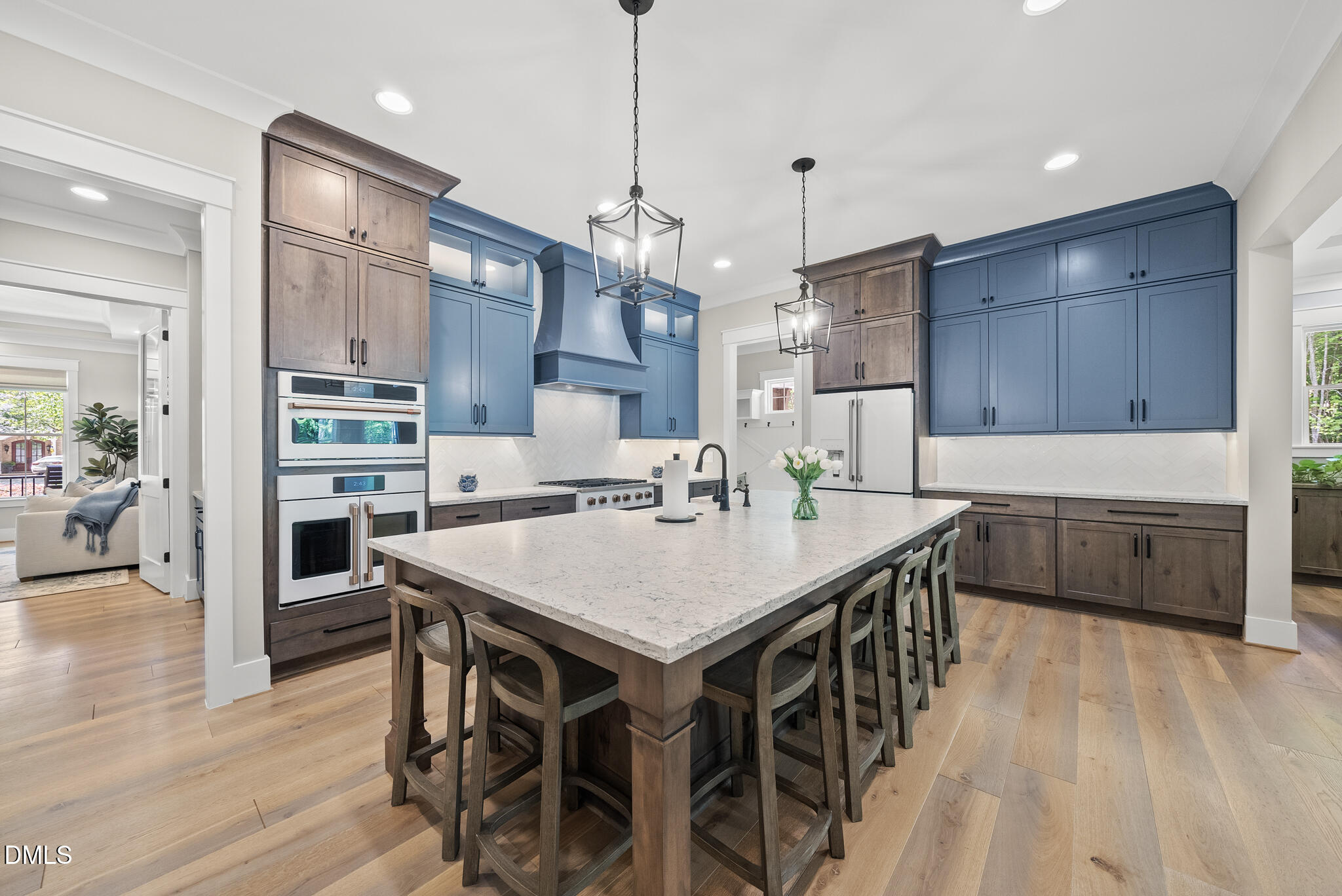 67 Nuthatch Pittsboro, NC 27312 - Photo 19 of 50 a kitchen with stainless steel appliances granite countertop a kitchen island a stove a table and chairs in it