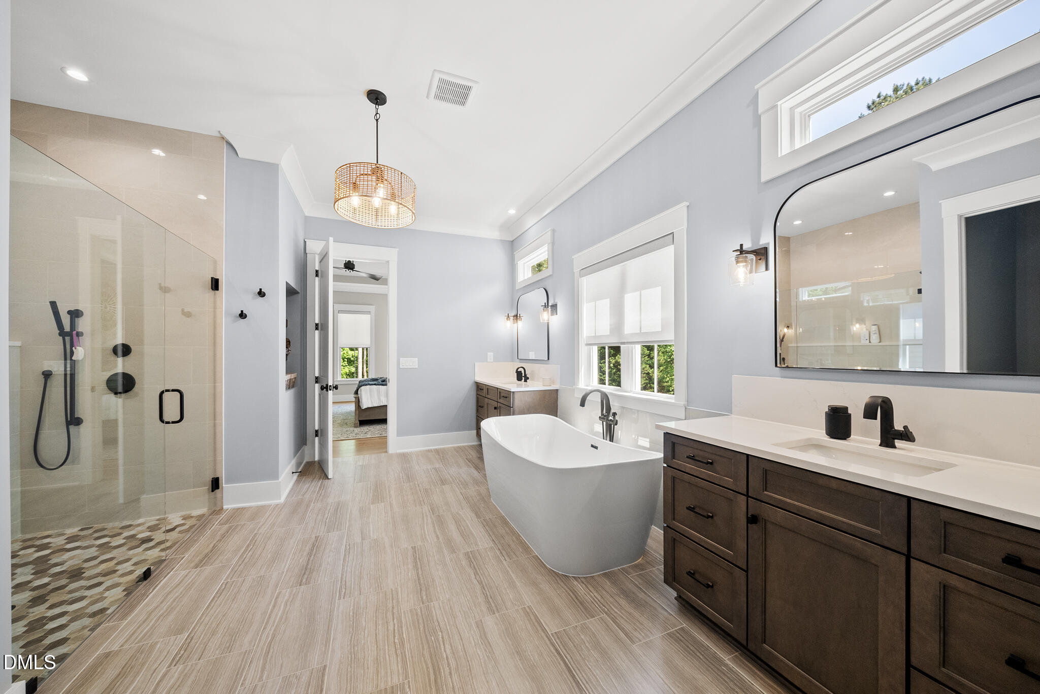 67 Nuthatch Pittsboro, NC 27312 - Photo 32 of 50 a spacious bathroom with a double vanity sink a mirror and a bathtub