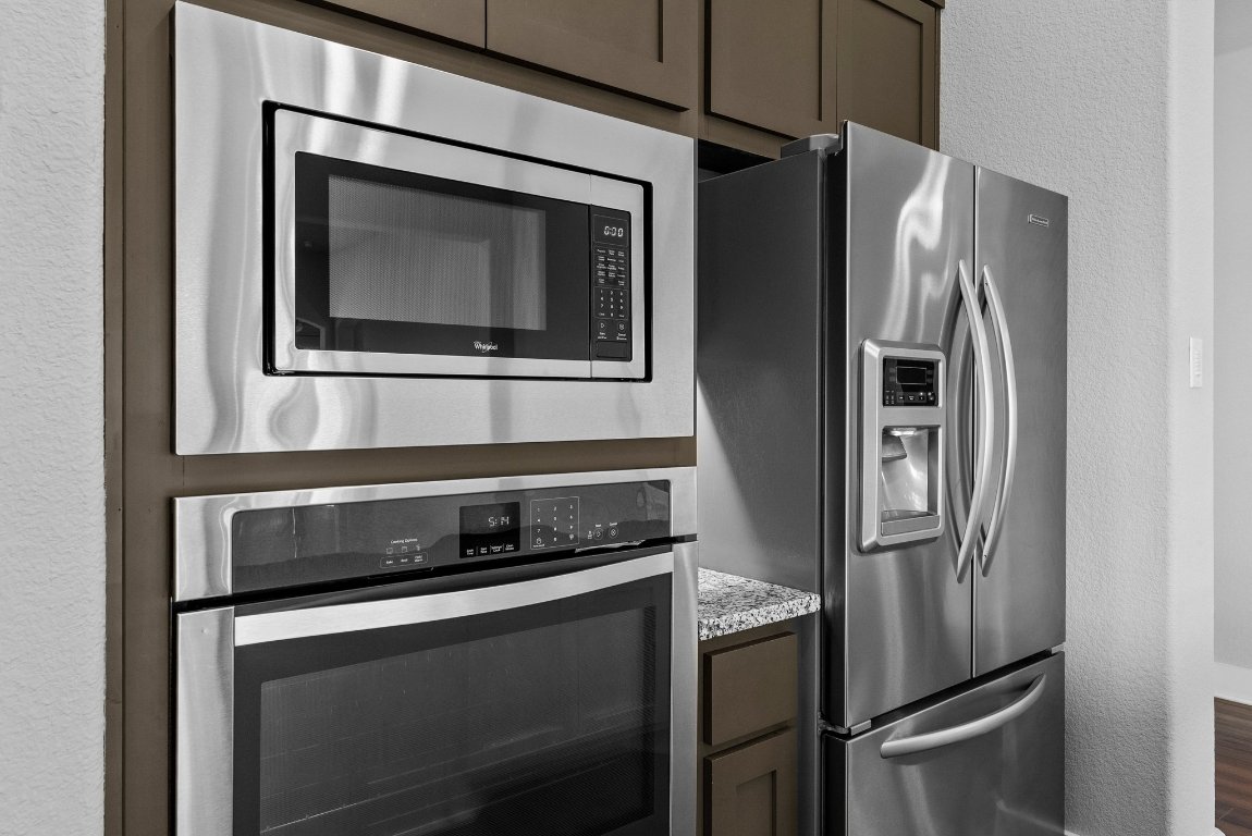 20525 Martin Lane Pflugerville, TX 78660 - Photo 12 of 40 Sleek stainless appliances and stylish cabinetry bring everyday function to high design.