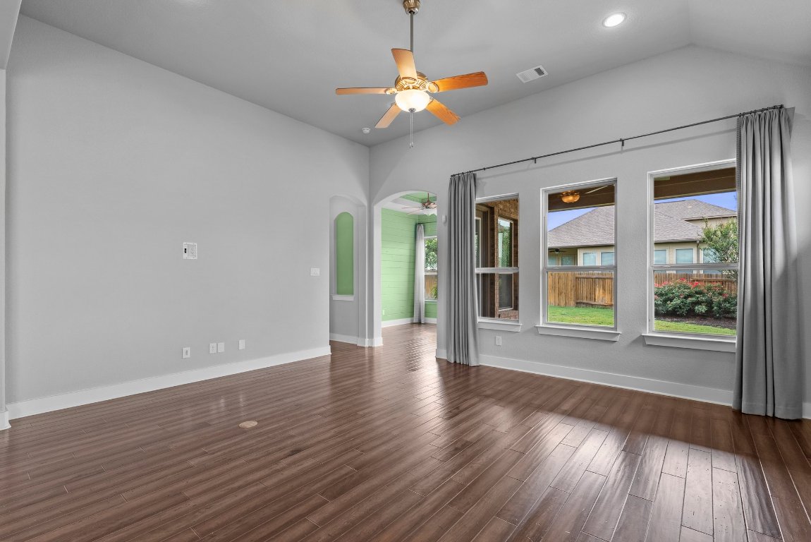 20525 Martin Lane Pflugerville, TX 78660 - Photo 15 of 40 The main living area flows beautifully—coffered ceilings, rich textures, and natural light at every turn.