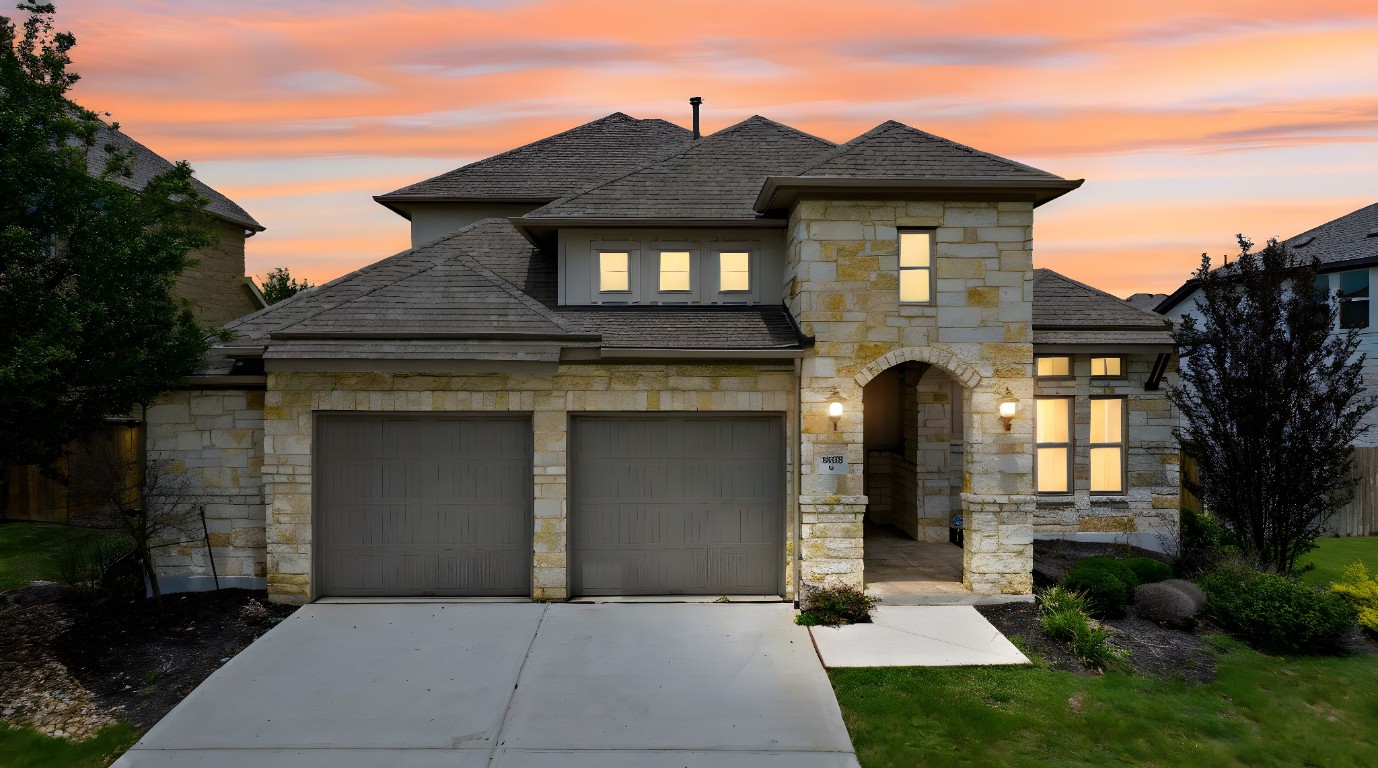 20525 Martin Lane Pflugerville, TX 78660 - Photo 2 of 40 Twilight elegance meets Hill Country charm—this exterior brings the wow from curb to entry.