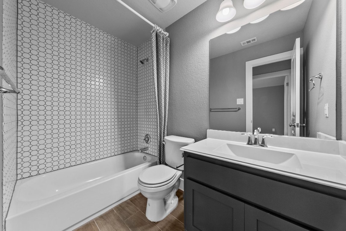 20525 Martin Lane Pflugerville, TX 78660 - Photo 31 of 40 With custom tile and playful patterns, this bath is full of personality.