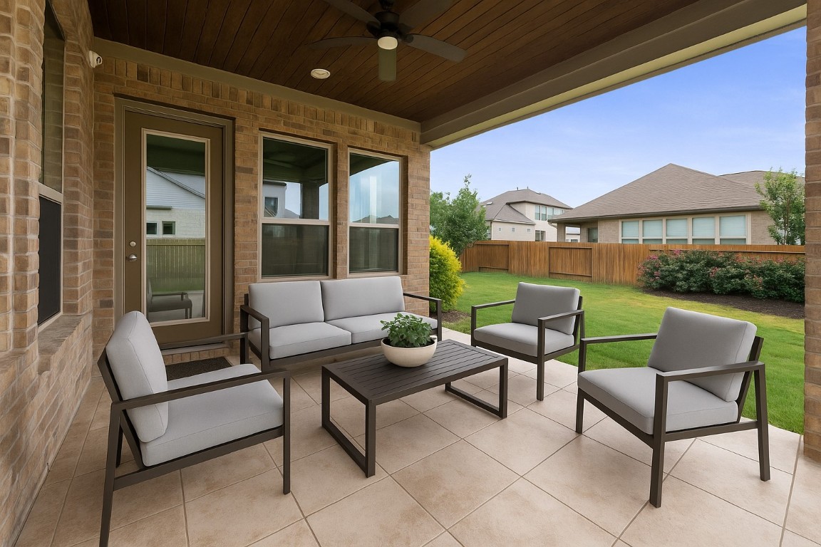20525 Martin Lane Pflugerville, TX 78660 - Photo 33 of 40 Outside, the covered patio sets the scene for laid-back evenings and weekend grilling with a shiplap ceiling and upgraded tile flooring. - Virtually Enhanced Photo