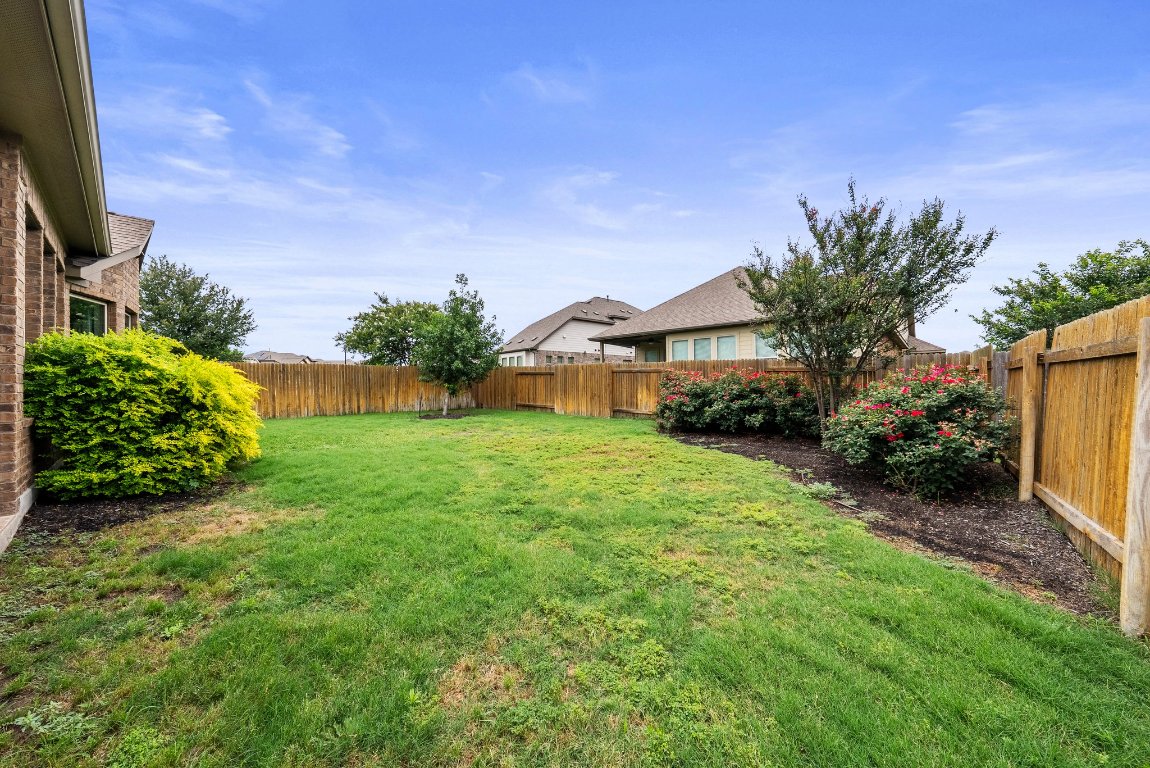 20525 Martin Lane Pflugerville, TX 78660 - Photo 35 of 40 Premium landscaping finishes the look with low-maintenance flair!