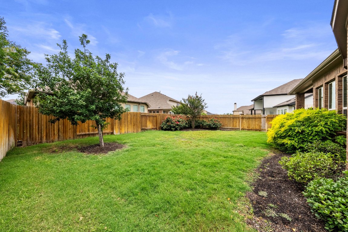 20525 Martin Lane Pflugerville, TX 78660 - Photo 36 of 40 Room for raised beds, a hammock, and maybe that smoker you’ve been eyeing—this yard’s got project potential.