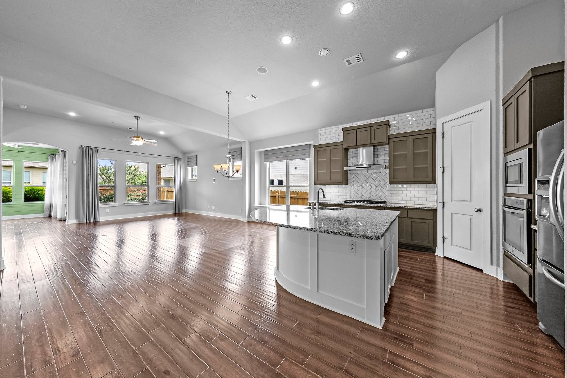 20525 Martin Lane Pflugerville, TX 78660 - Photo 5 of 40 Light, bright, and loaded with character—custom wall accents and designer finishes throughout.