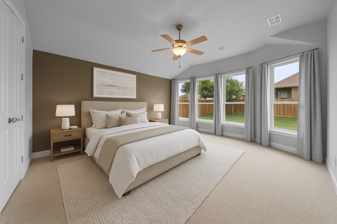 20525 Martin Lane Pflugerville, TX 78660 - Photo 7 of 40 The main-level primary suite is a private retreat with dual vanities, a custom surround soaking tub, and warm natural light. - Virtually Enhanced Photo