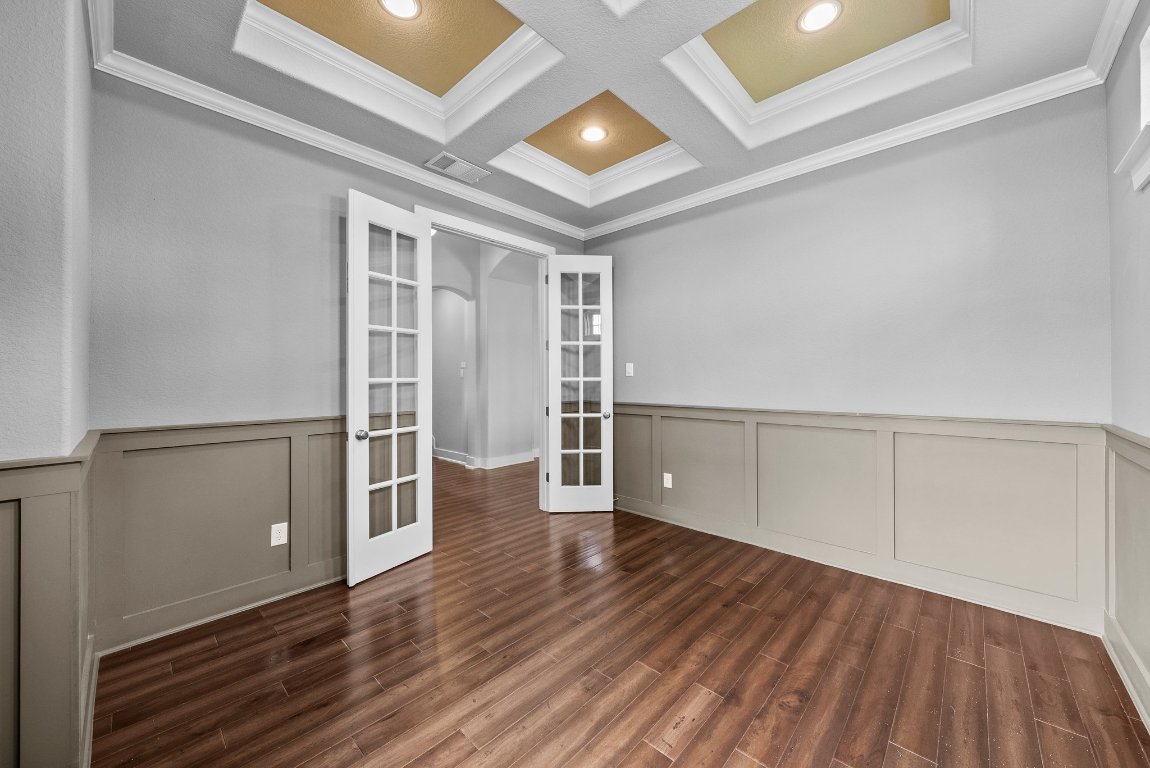 20525 Martin Lane Pflugerville, TX 78660 - Photo 10 of 40 Coffered ceilings, paneled walls, built-in features, and bold accent paint bring personality and polish to every space.