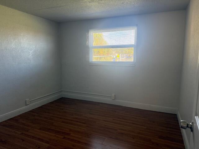 2840 Avenue S A Riviera Beach, Unit 3 Riviera Beach, FL 33404 - Photo 20 of 23 a view of an empty room with wooden floor and a window