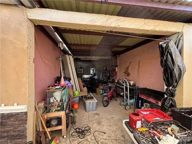 a view of a street with cars parked