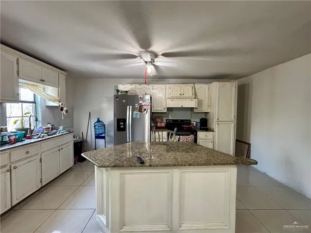a kitchen with stainless steel appliances granite countertop a sink and dishwasher