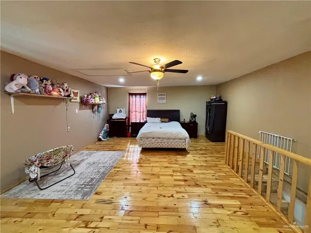 a bed room with a bed and a television