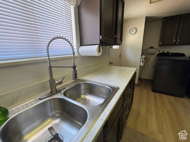 527 Palisade Drive Moab, UT 84532 - Photo 6 of 51 Kitchen featuring washer / dryer, w/ NEW LPV floors, new countertops, and dark brown cabinetry