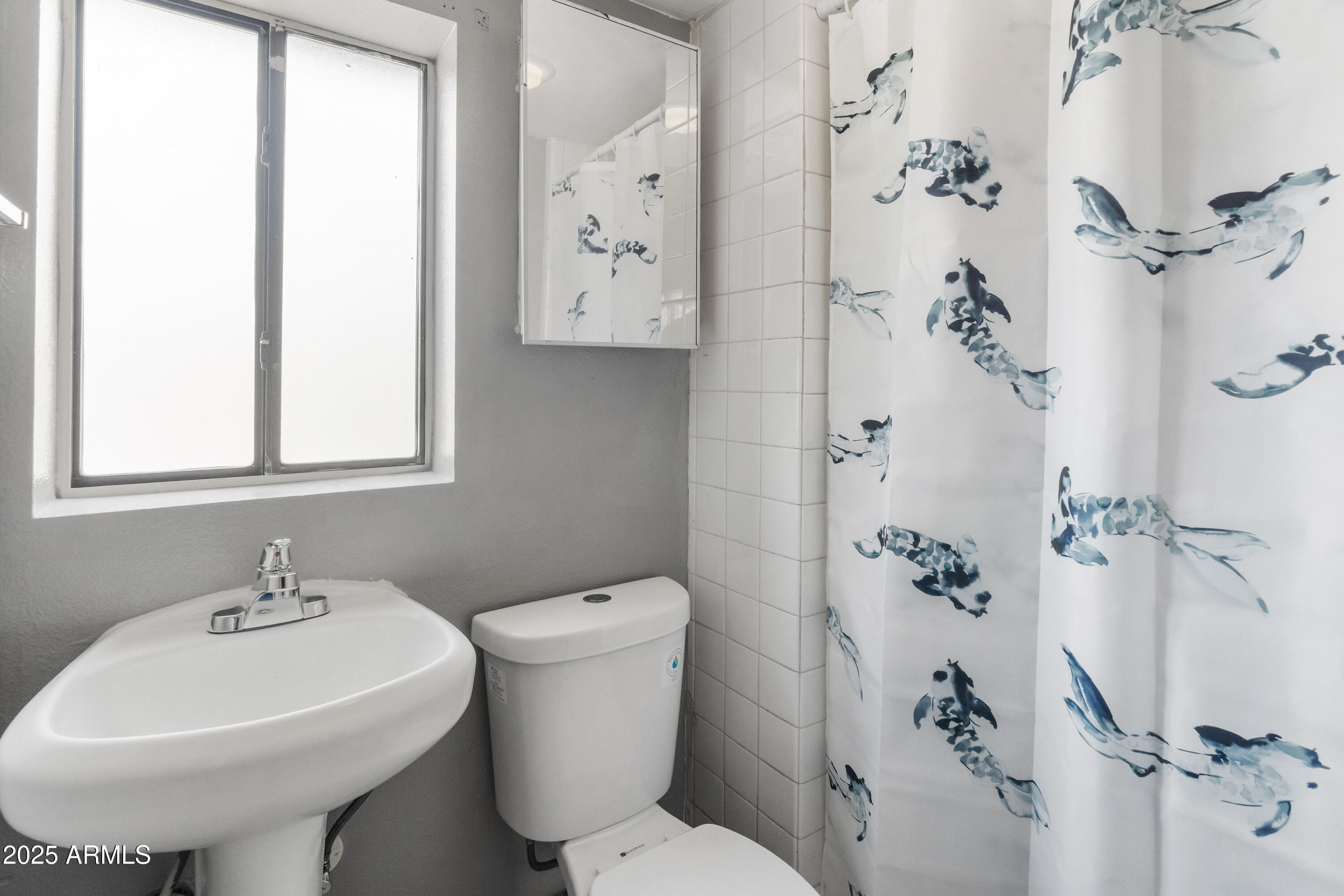 122 North 9th Avenue Phoenix, AZ 85007 - Photo 11 of 43 a bathroom with a sink toilet and shower