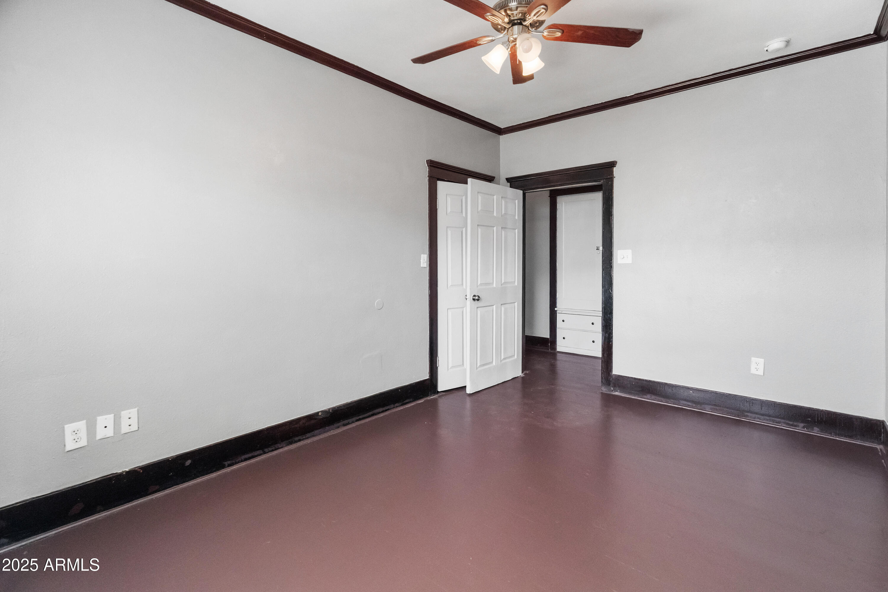 122 North 9th Avenue Phoenix, AZ 85007 - Photo 17 of 43 an empty room with a ceiling fan and wooden floor