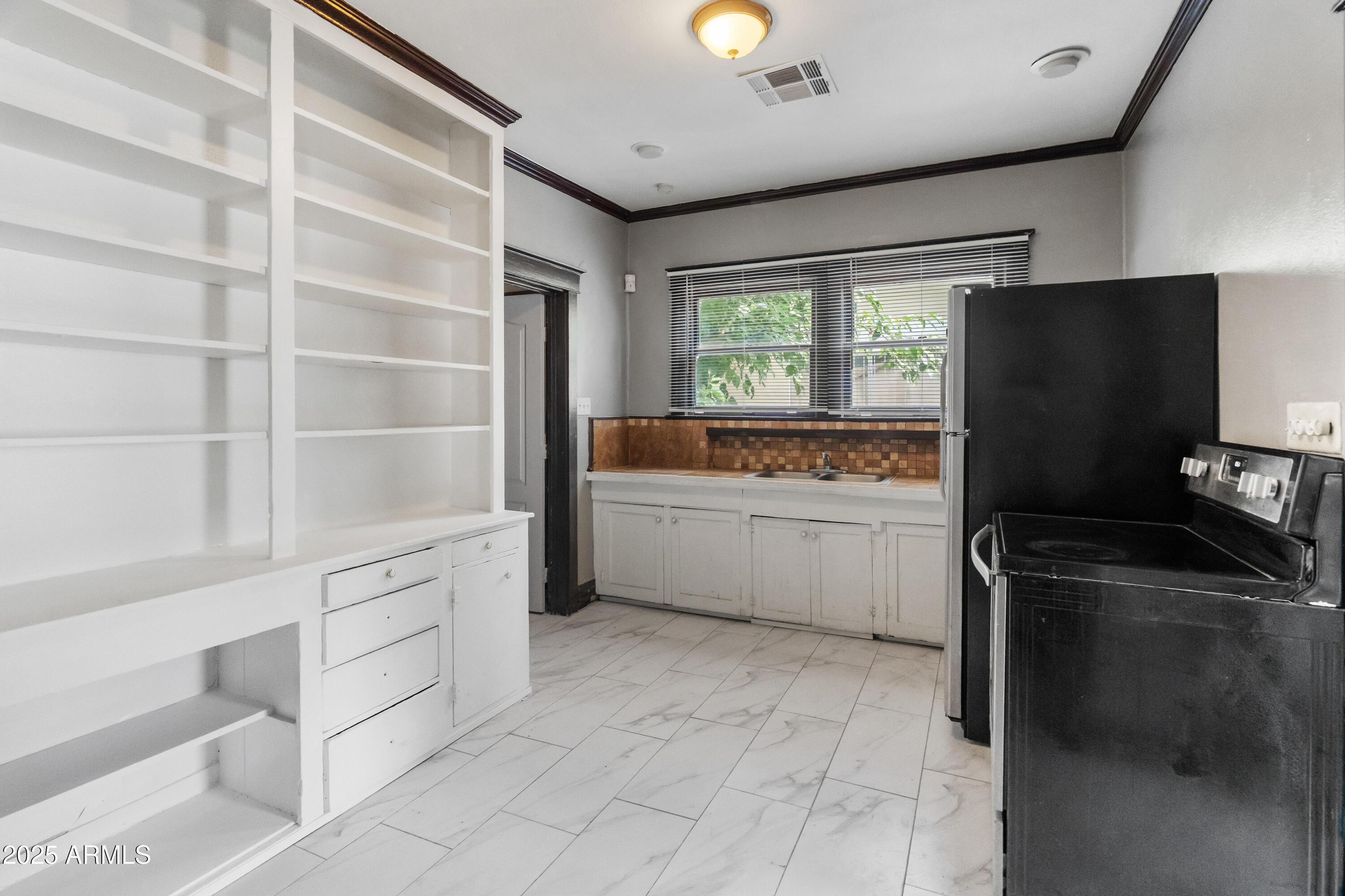 122 North 9th Avenue Phoenix, AZ 85007 - Photo 18 of 43 a kitchen with a refrigerator and a sink