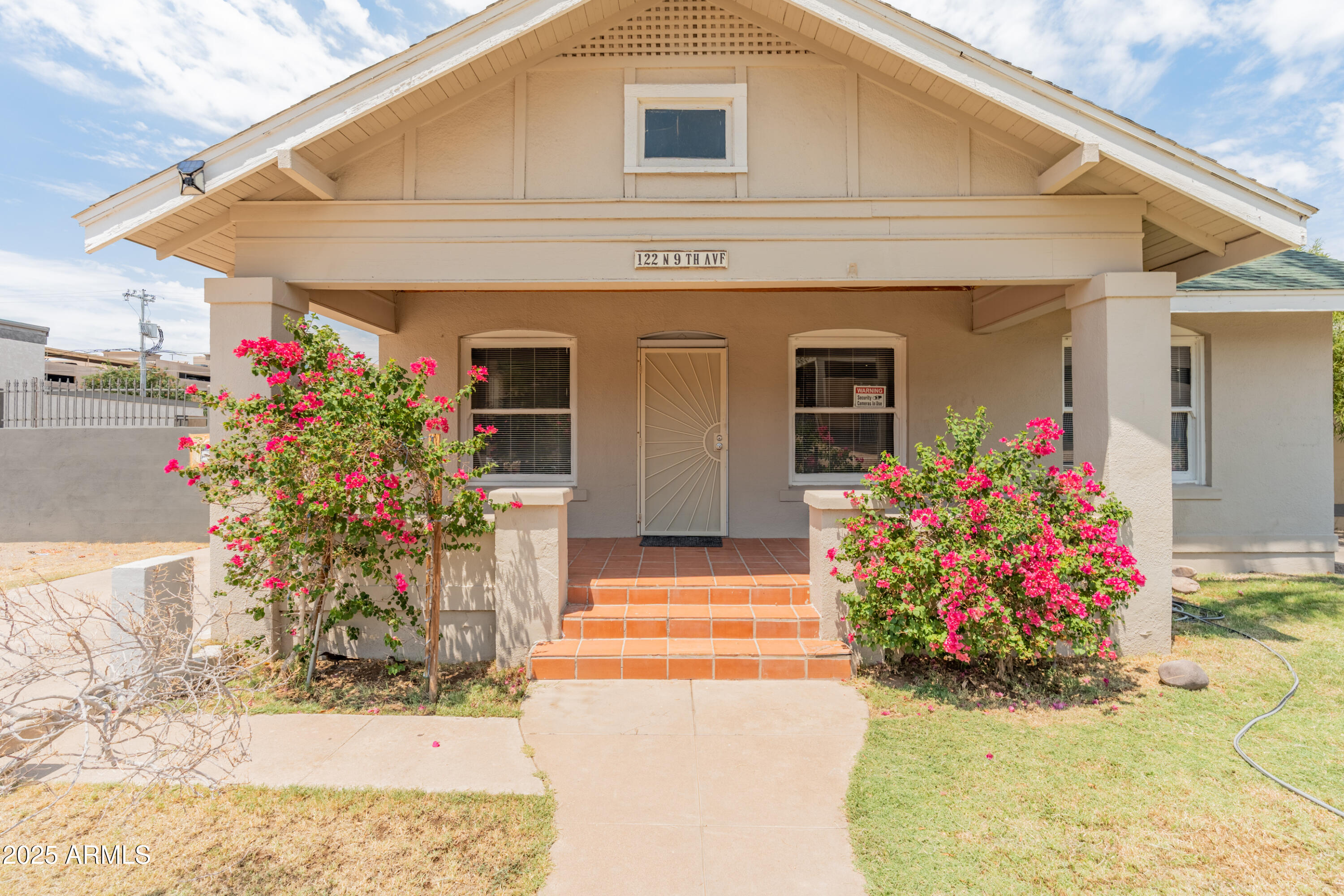 122 North 9th Avenue Phoenix, AZ 85007 - Photo 2 of 43 a front view of house with flowers
