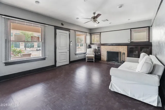 a living room with furniture and a fireplace