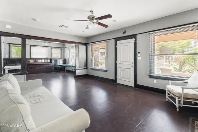 a living room with furniture and a fireplace