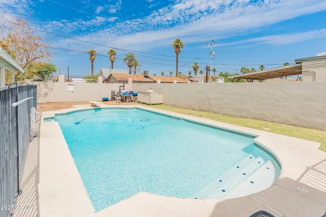 swimming pool view with a outdoor space