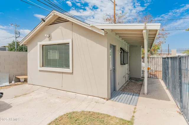 a view of an empty room with a refrigerator