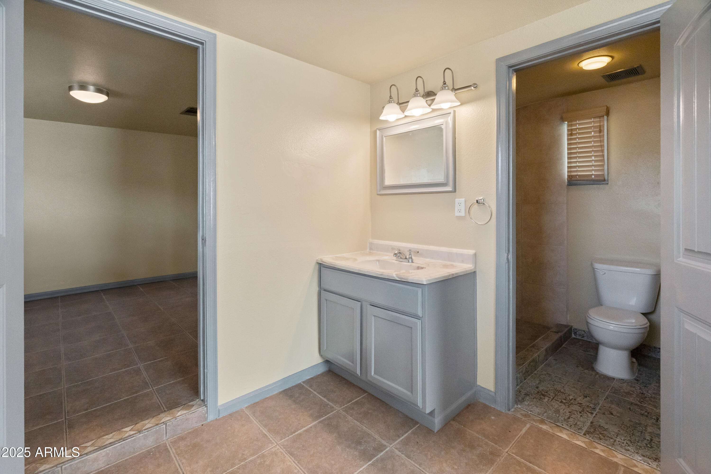 122 North 9th Avenue Phoenix, AZ 85007 - Photo 38 of 43 a bathroom with a granite countertop sink toilet and shower