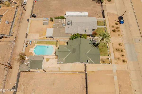 an aerial view of residential houses with outdoor space
