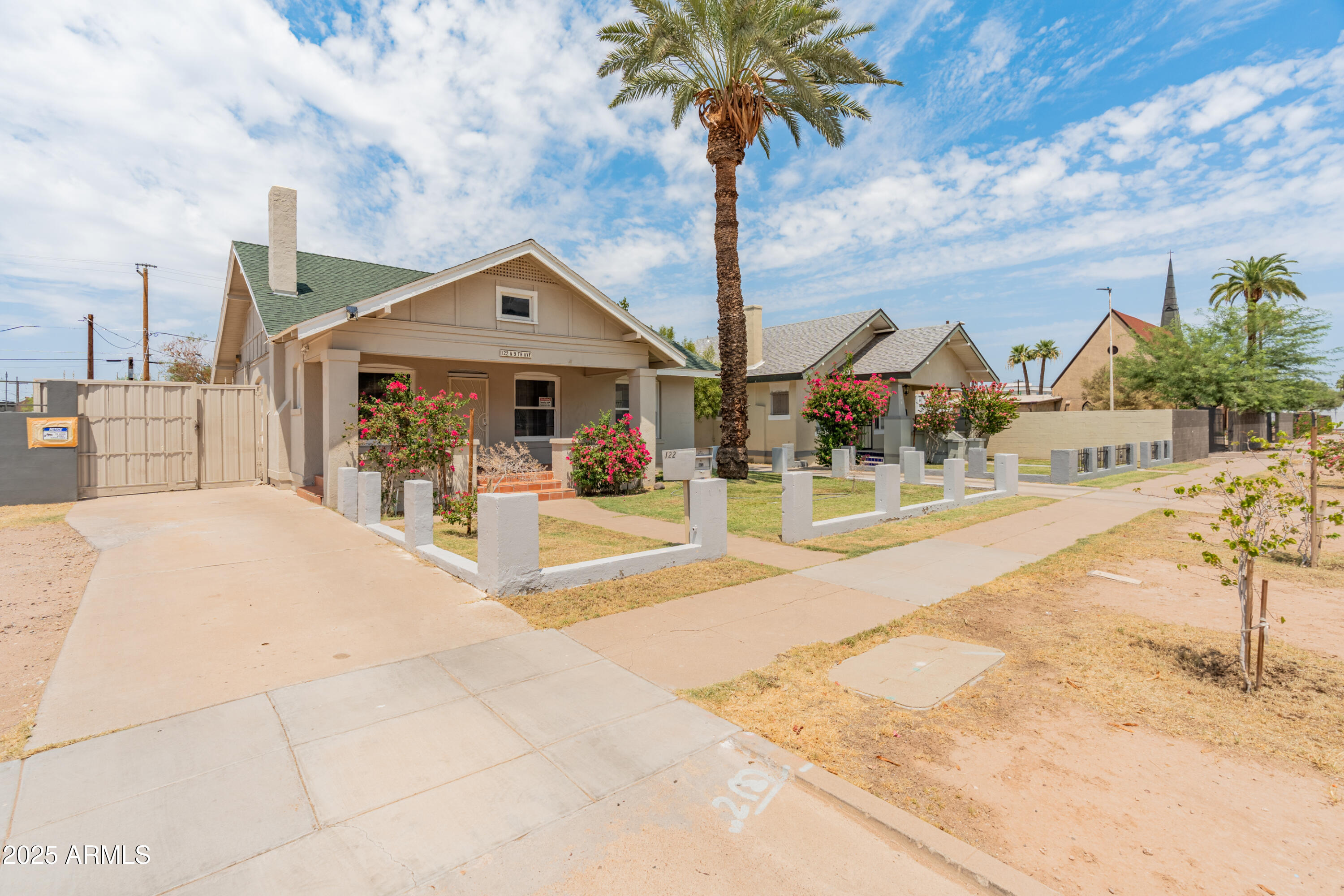 122 North 9th Avenue Phoenix, AZ 85007 - Photo 6 of 43 a front view of a house with palm trees
