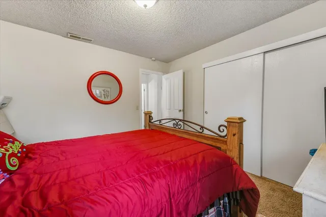 a bathroom with a toilet a sink and a mirror