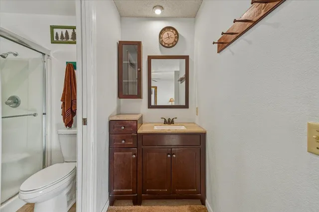 a living room with furniture a window and a flat screen tv