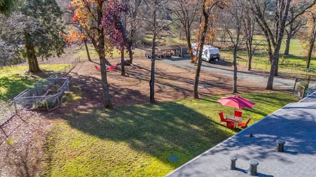 a view of a backyard of the house