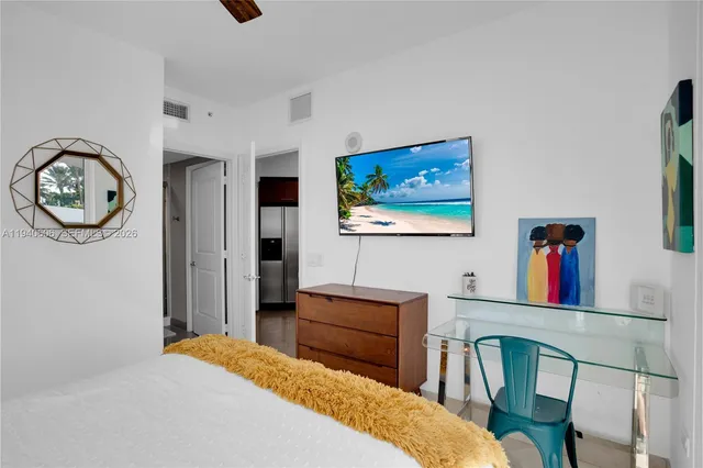 a bedroom with furniture and a table