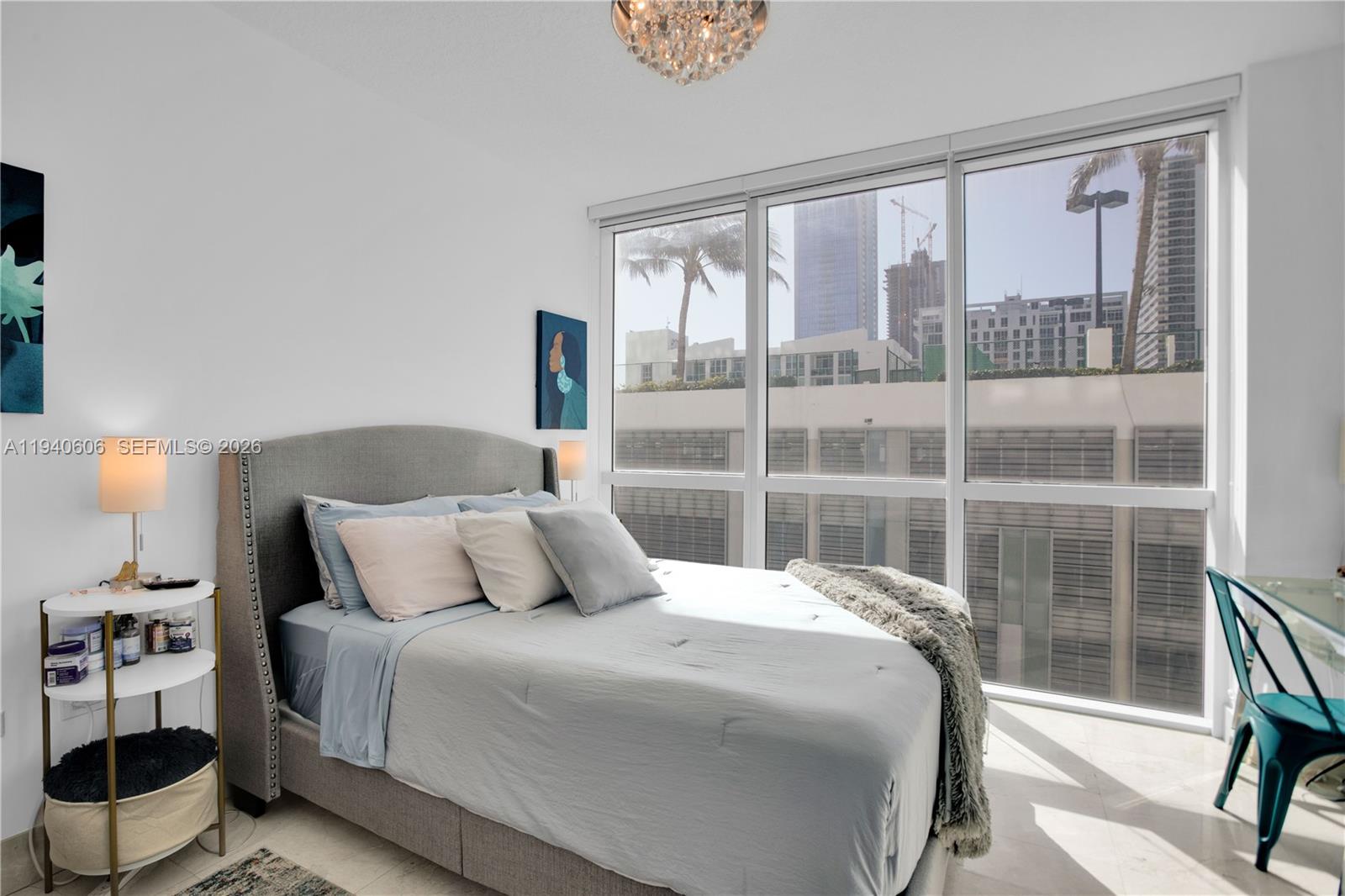 480 Northeast 30th Street, Unit 705 Miami, FL 33137 - Photo 21 of 32 a bedroom with a large bed and a large window