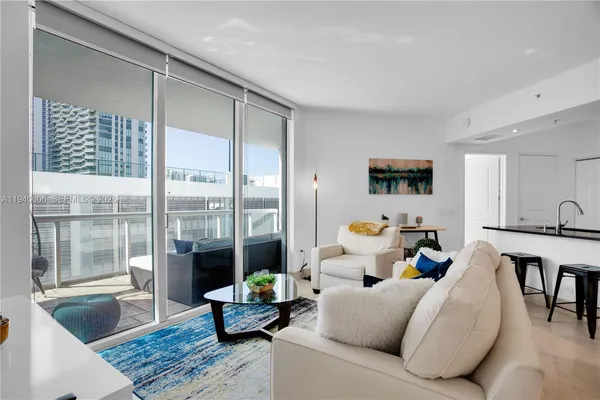 a living room with furniture and a table