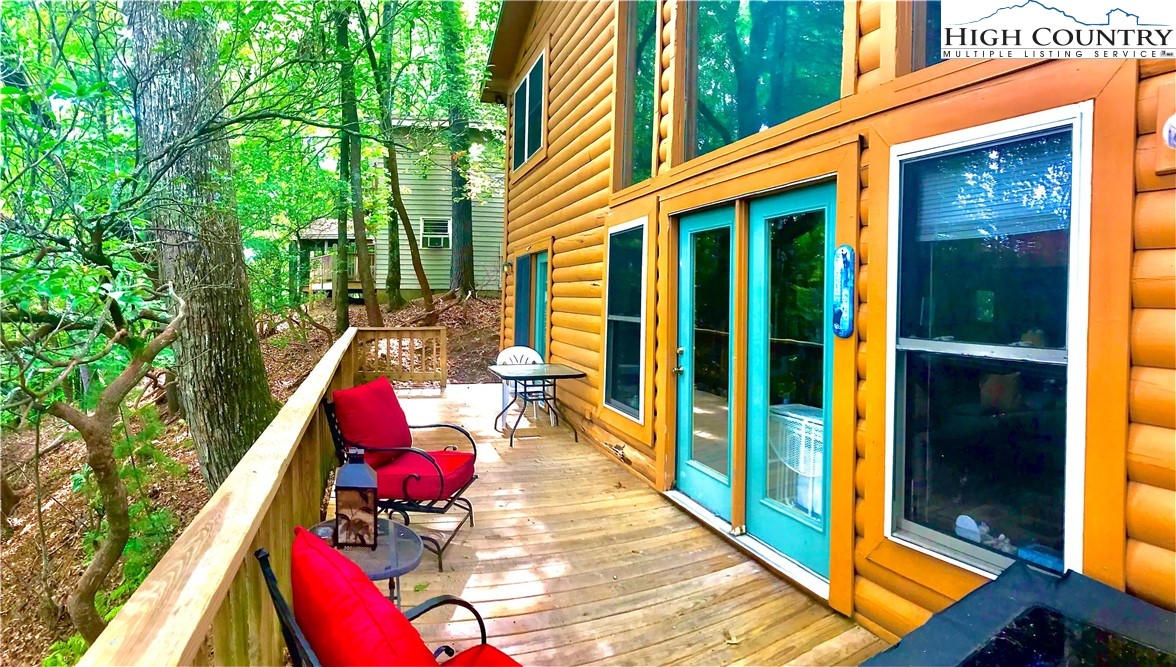 326 Buckshot Ridge Road Deep Gap, NC 28618 - Photo 1 of 29 a view of a two chairs in the balcony