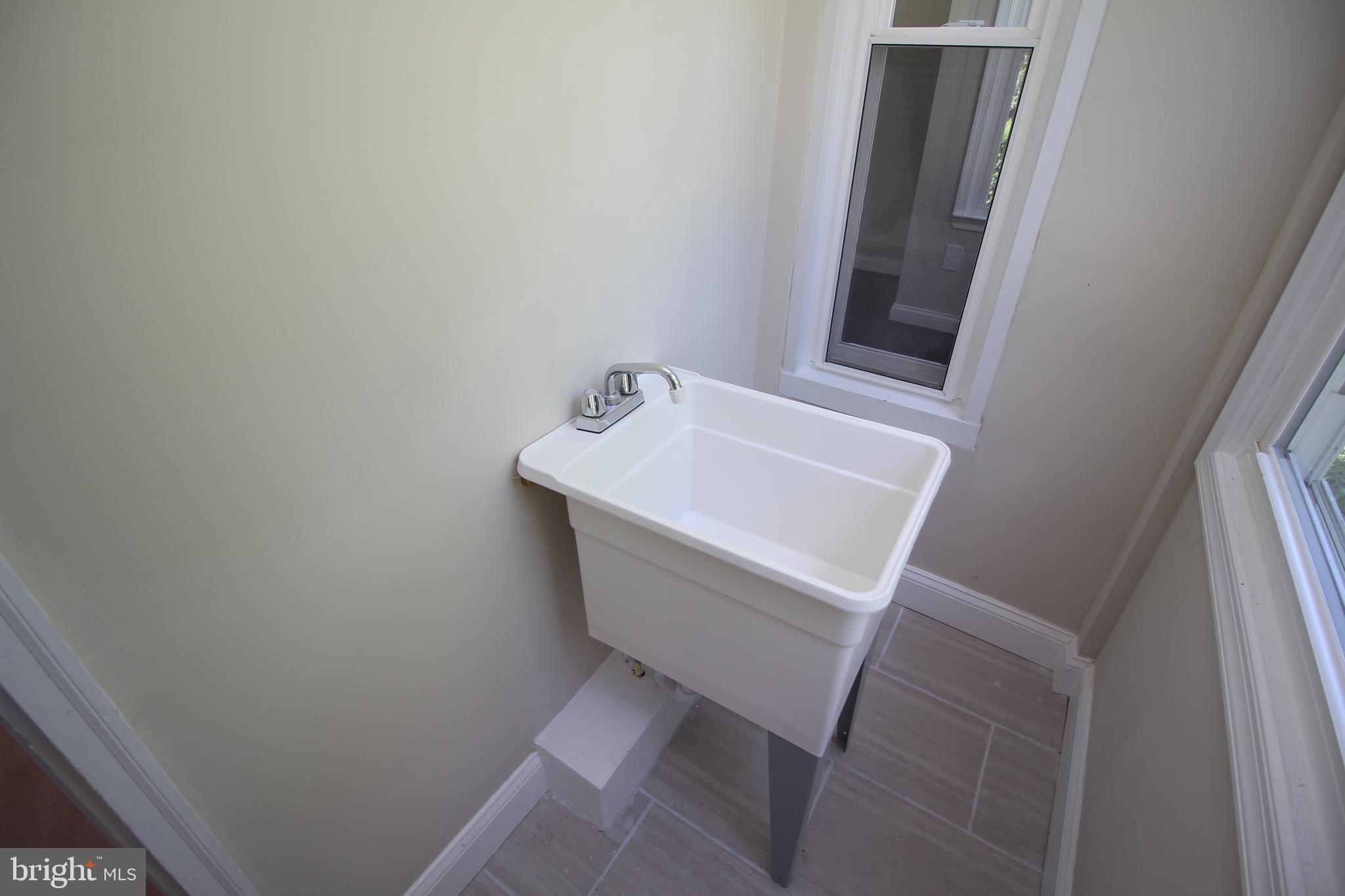 18030 Barnesville Road Barnesville, MD 20838 - Photo 28 of 39 Laundry sink off Kitchen with side entrance