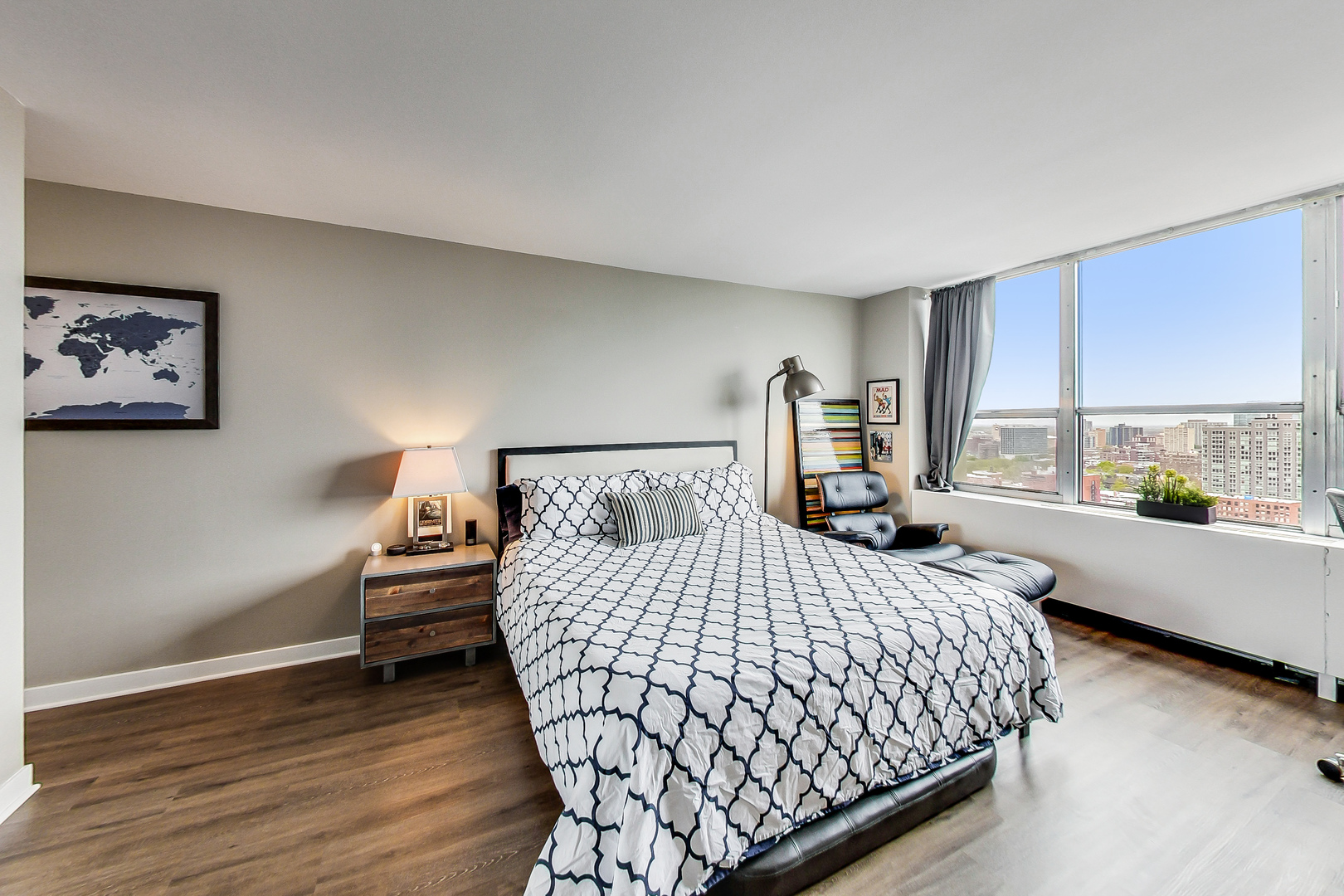 655 West Irving Park Road, Unit 2210 Chicago, IL 60613 - Photo 11 of 38 a bedroom with a large bed and a large window